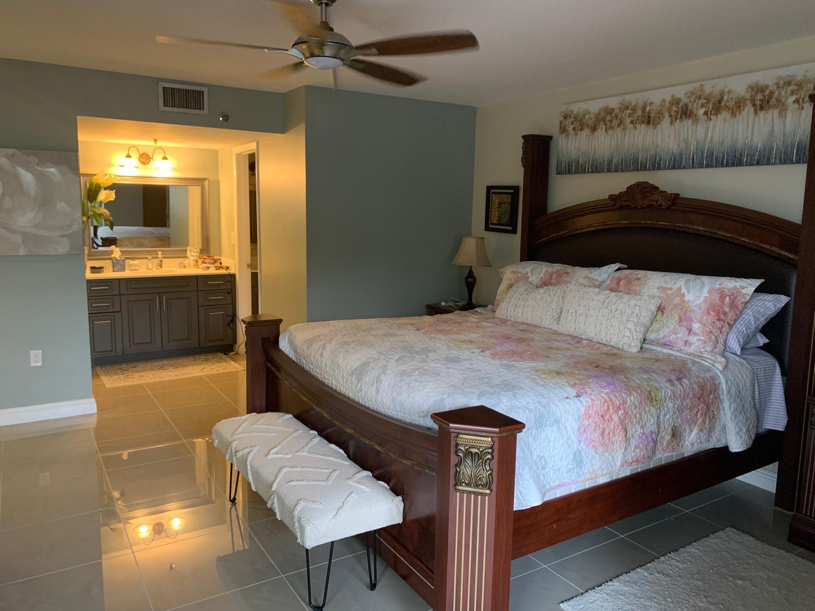 3940 Inverrary Boulevard, Unit 302A Lauderhill, FL 33319 - Photo 32 of 33 a bedroom with a bed and a walk in closet