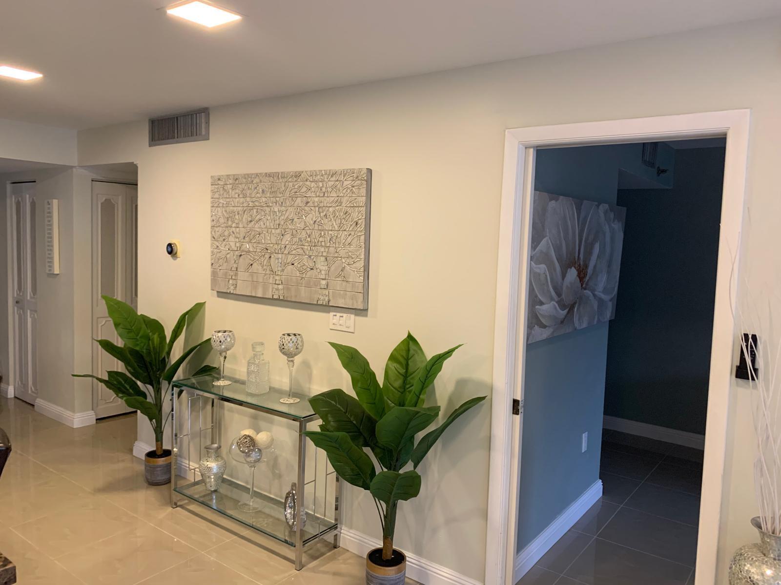 3940 Inverrary Boulevard, Unit 302A Lauderhill, FL 33319 - Photo 33 of 33 a view of a hallway with potted plant
