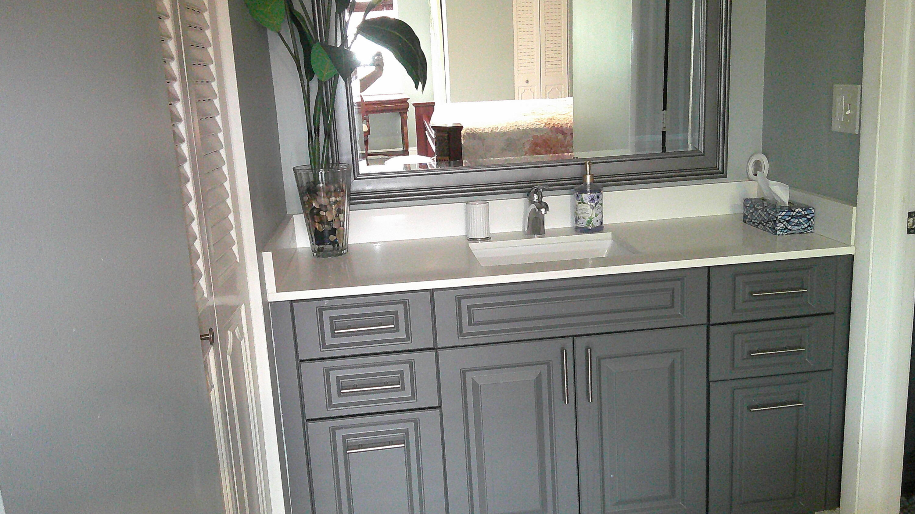 3940 Inverrary Boulevard, Unit 302A Lauderhill, FL 33319 - Photo 8 of 33 a sink with a mirror