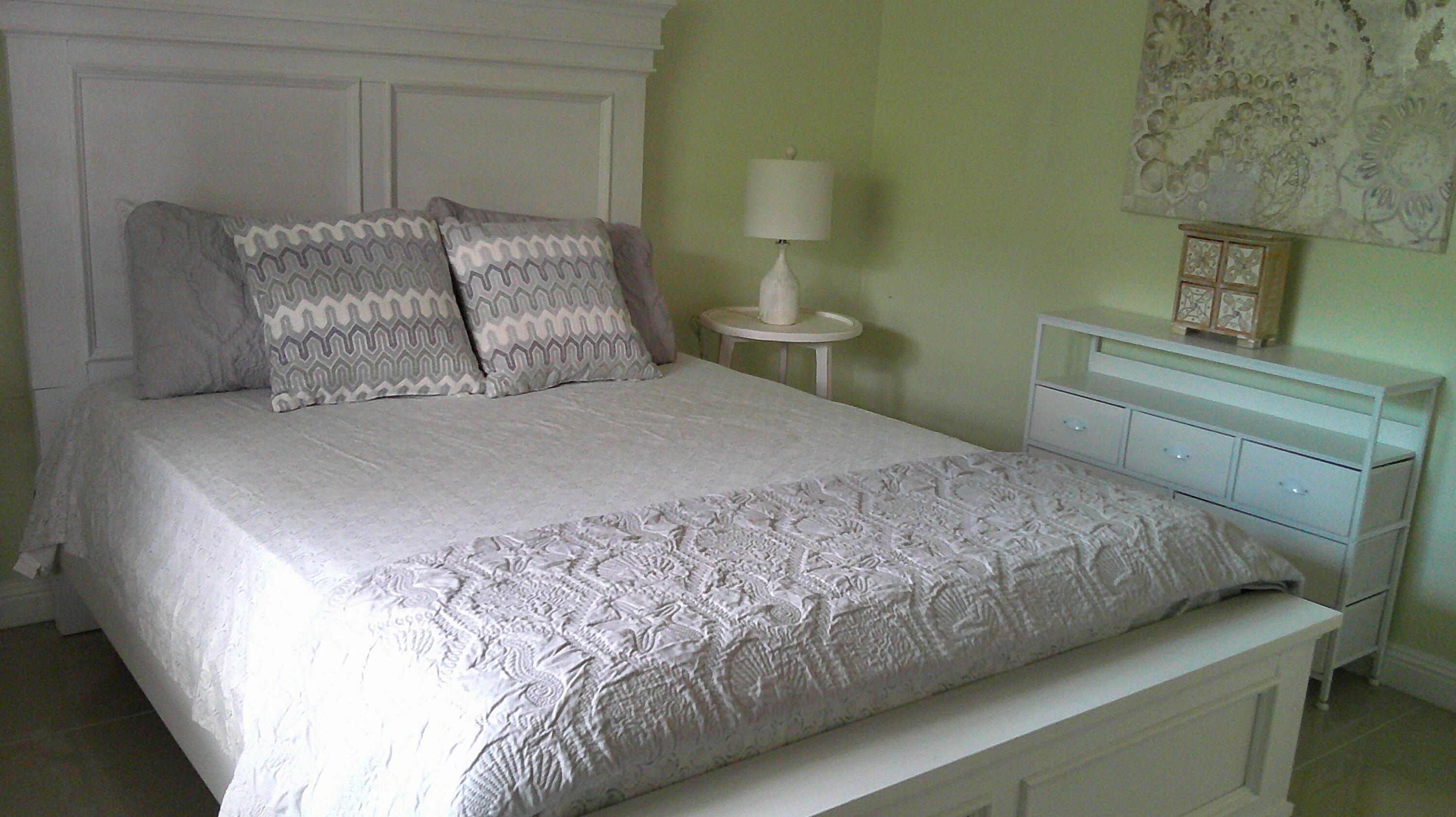 3940 Inverrary Boulevard, Unit 302A Lauderhill, FL 33319 - Photo 10 of 33 a bedroom with a bed and a night stand