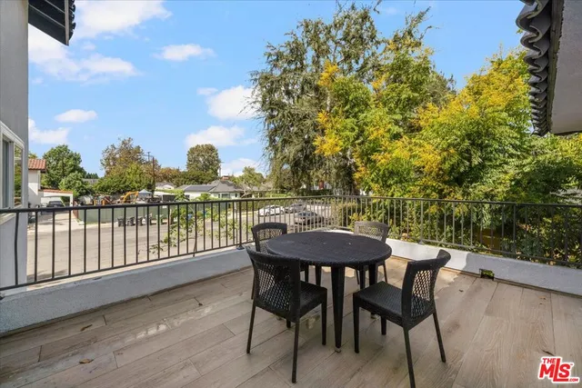 a view of a chairs and table on the deck