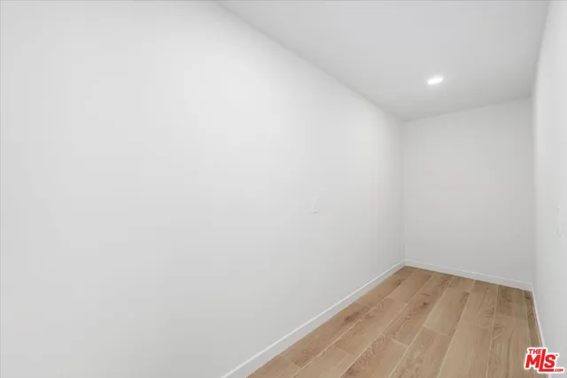 a bathroom with a shower and a sink