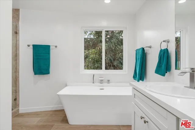 a bedroom with a bed and a chair