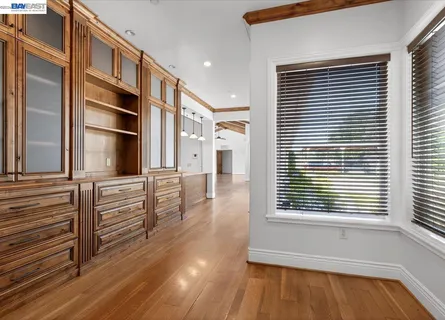a bathroom with a granite countertop toilet sink and mirror