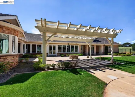 an aerial view of a house with outdoor space and street view