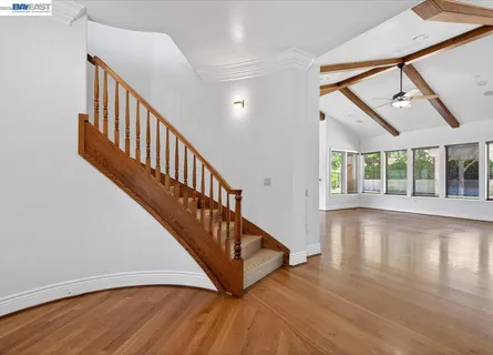 a view of an entryway with wooden floor