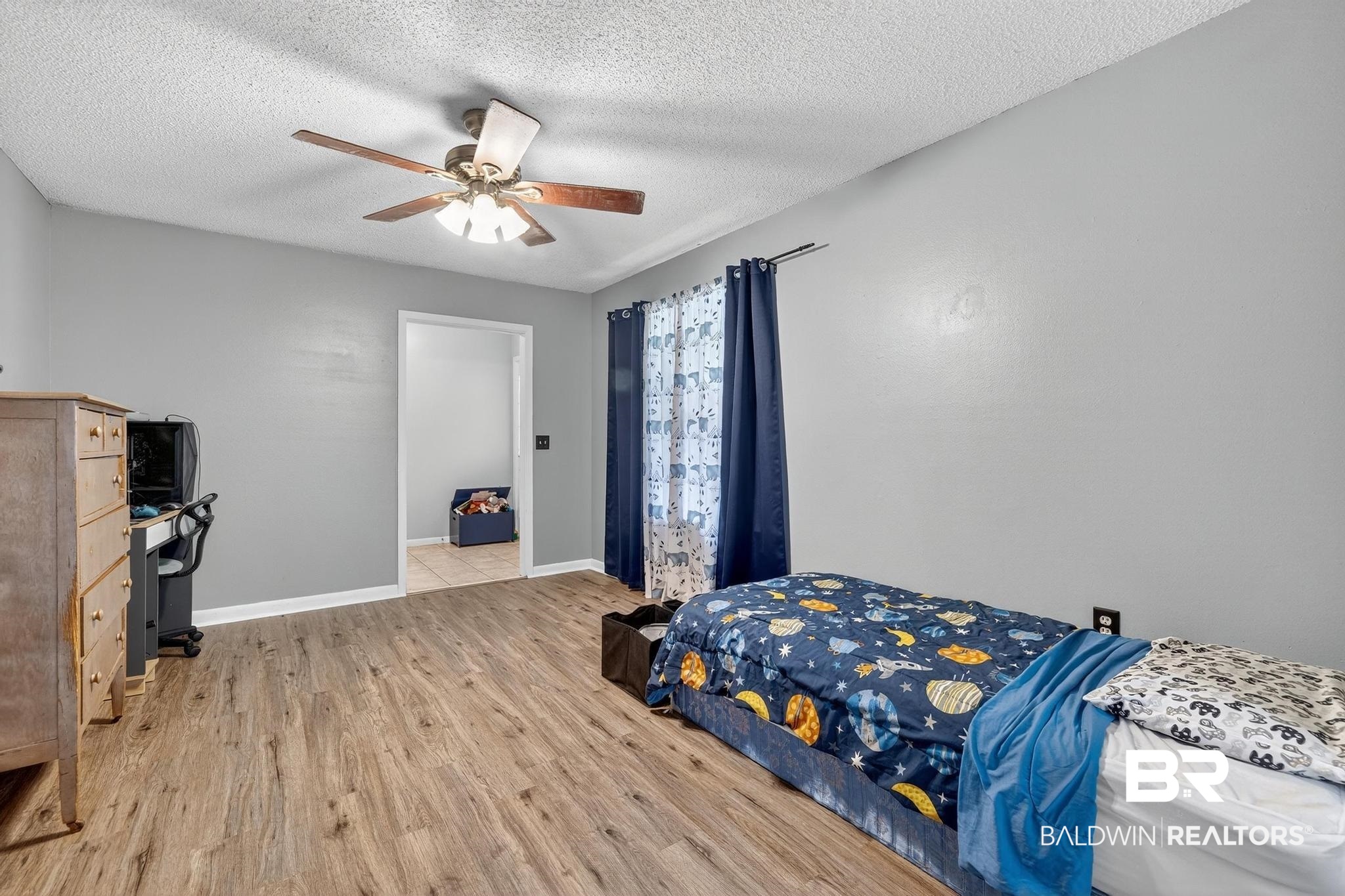 21895 2nd Street Silverhill, AL 36576 - Photo 28 of 43 Den featuring light wood-style flooring and a ceiling fan