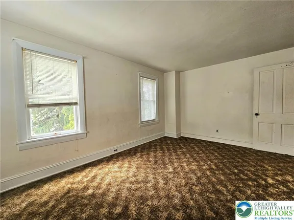 a view of an empty room with window