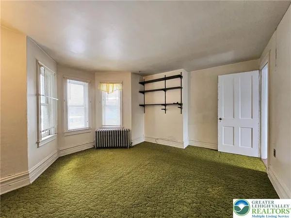 an empty room with windows