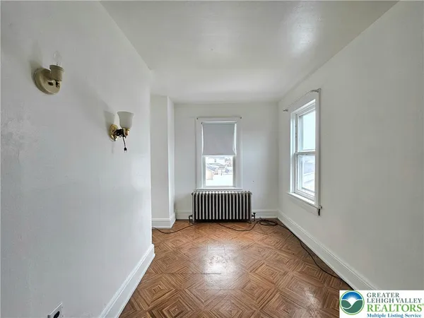 a view of an empty room and window