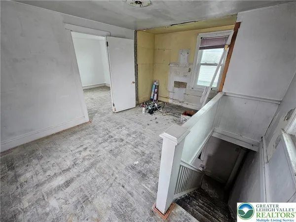 a view of living room with furniture and flat screen tv