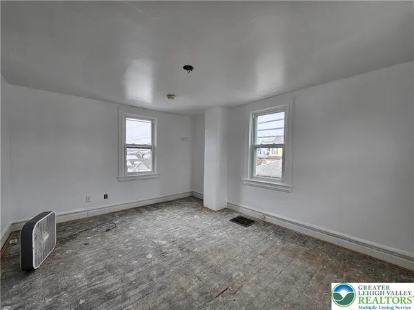 an empty room with windows