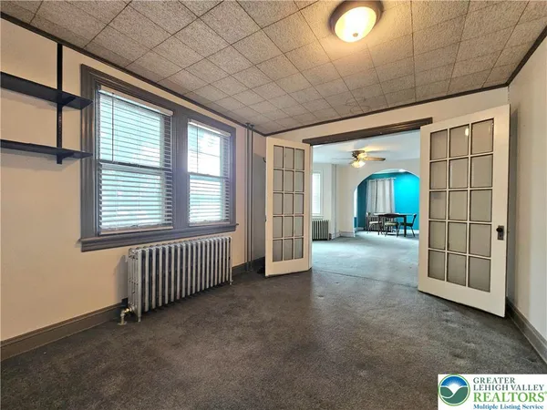 a view of livingroom with furniture and window