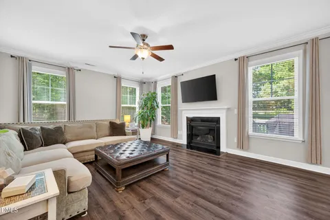 a view of a dining room with furniture large window and wooden floor