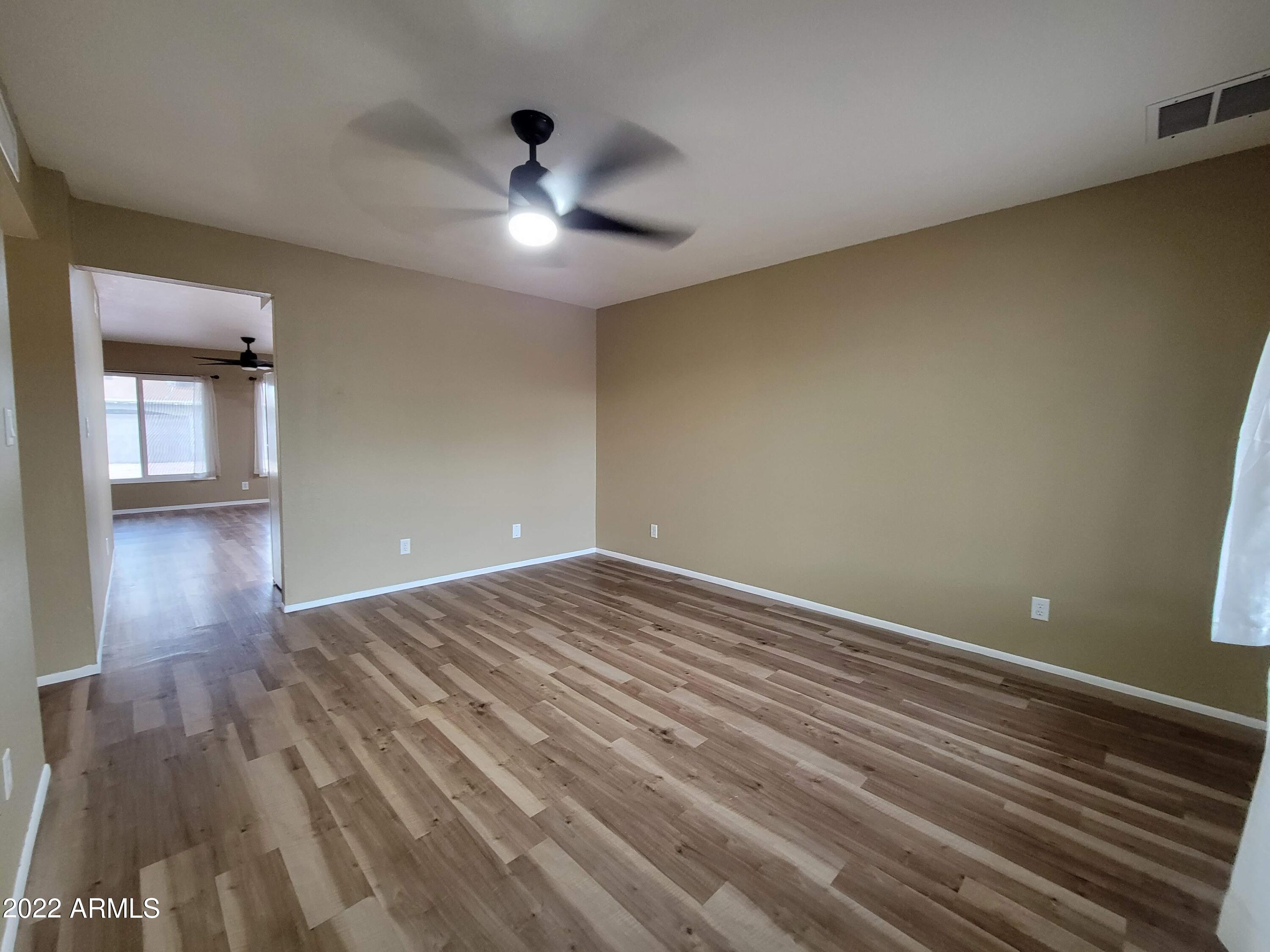 2042 West Decatur Street Mesa, AZ 85201 - Photo 12 of 38 a view of empty room with wooden floor