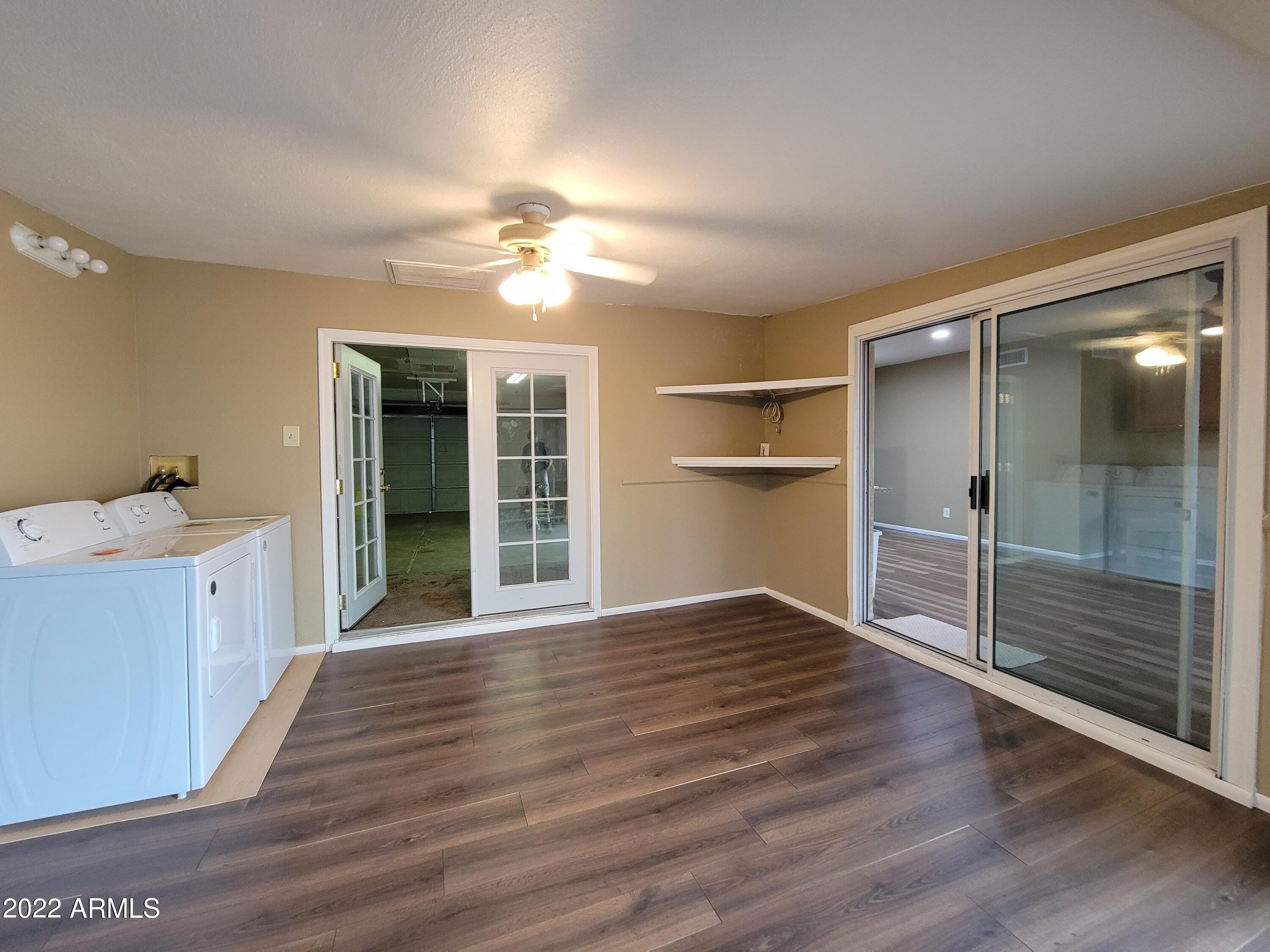 2042 West Decatur Street Mesa, AZ 85201 - Photo 15 of 38 wooden floor in an empty room with a window