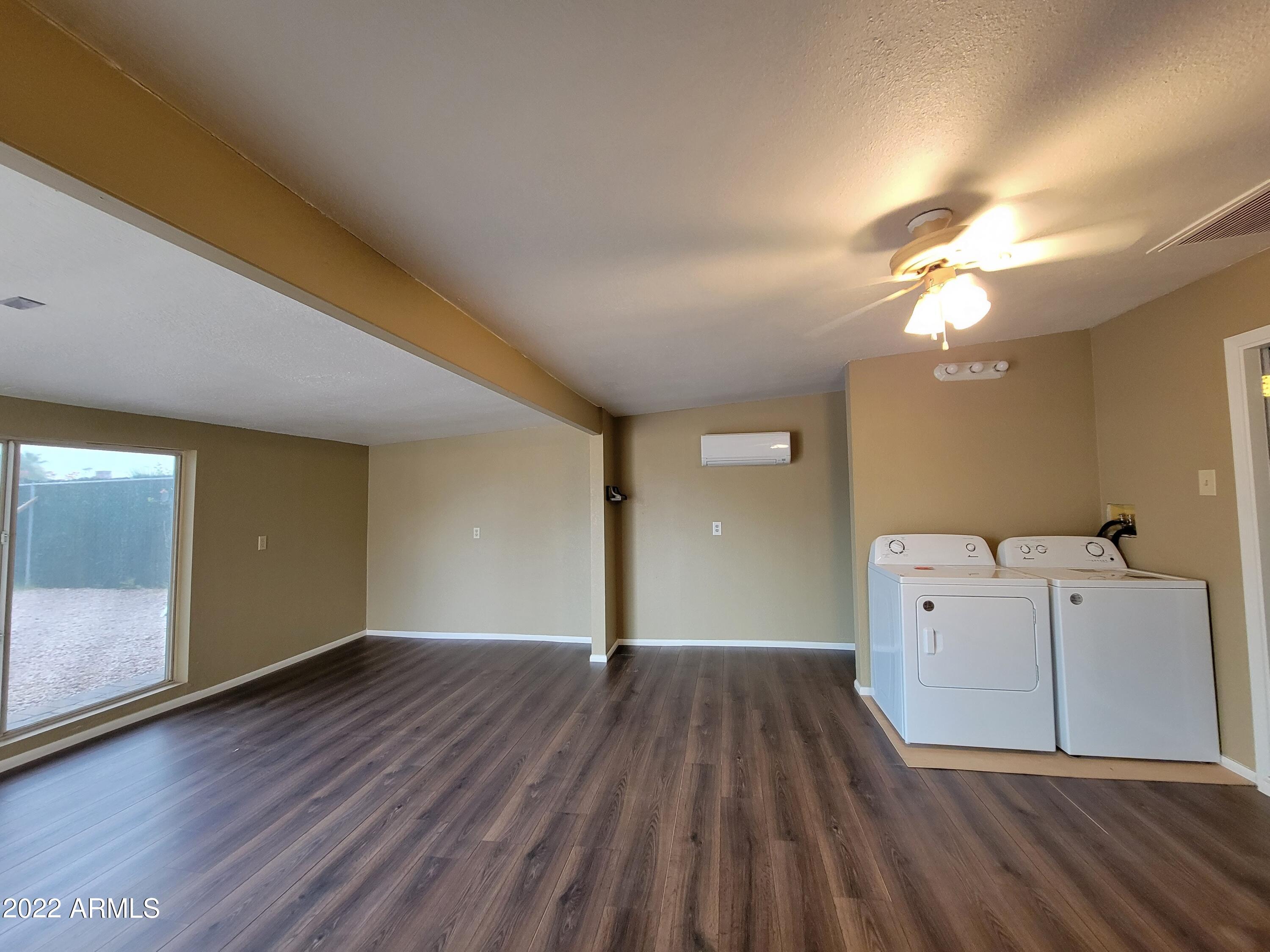 2042 West Decatur Street Mesa, AZ 85201 - Photo 18 of 38 a view of an empty room with wooden floor