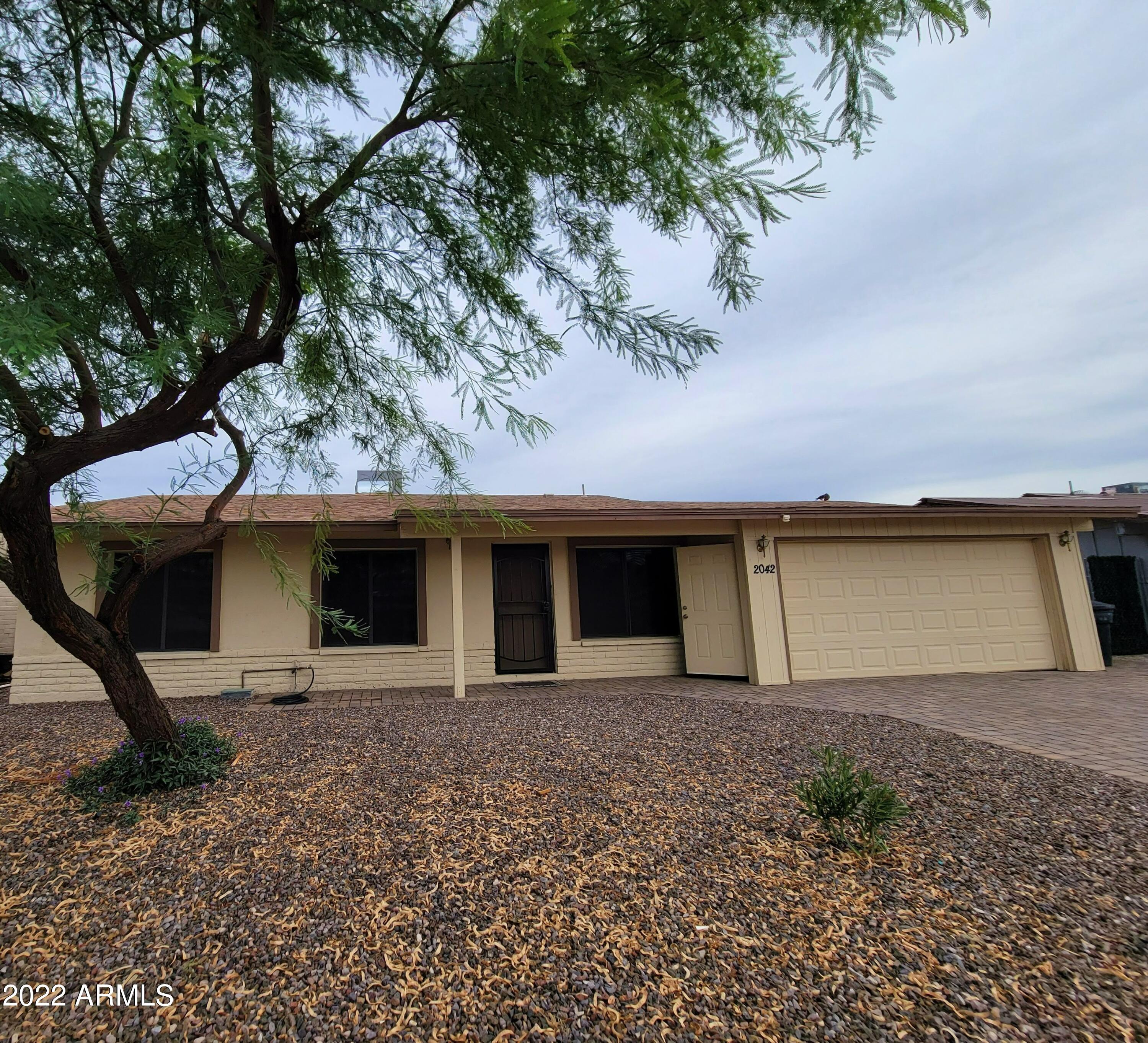 2042 West Decatur Street Mesa, AZ 85201 - Photo 2 of 38 a view of a house with a yard