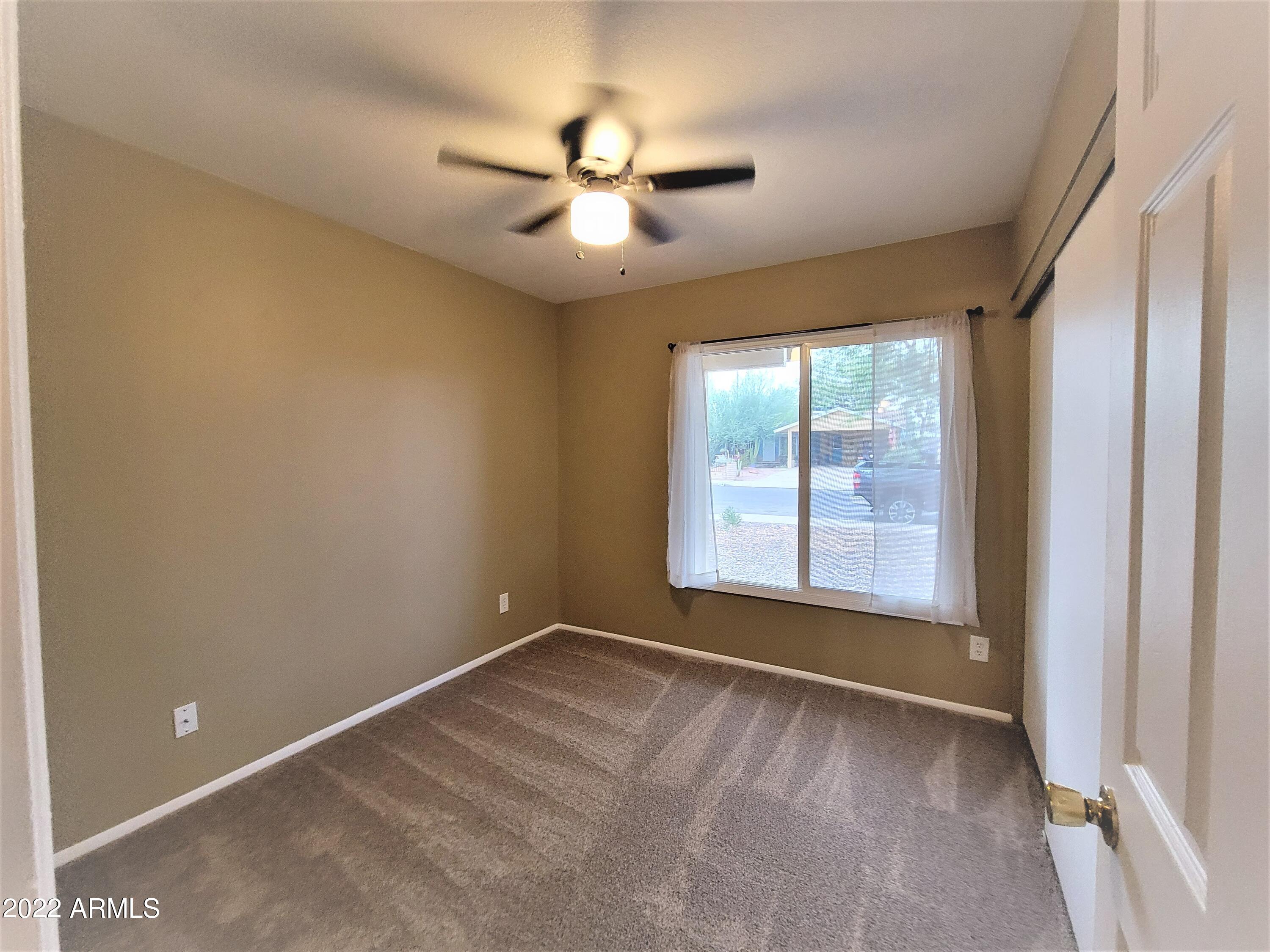 2042 West Decatur Street Mesa, AZ 85201 - Photo 27 of 38 a view of an empty room with a window
