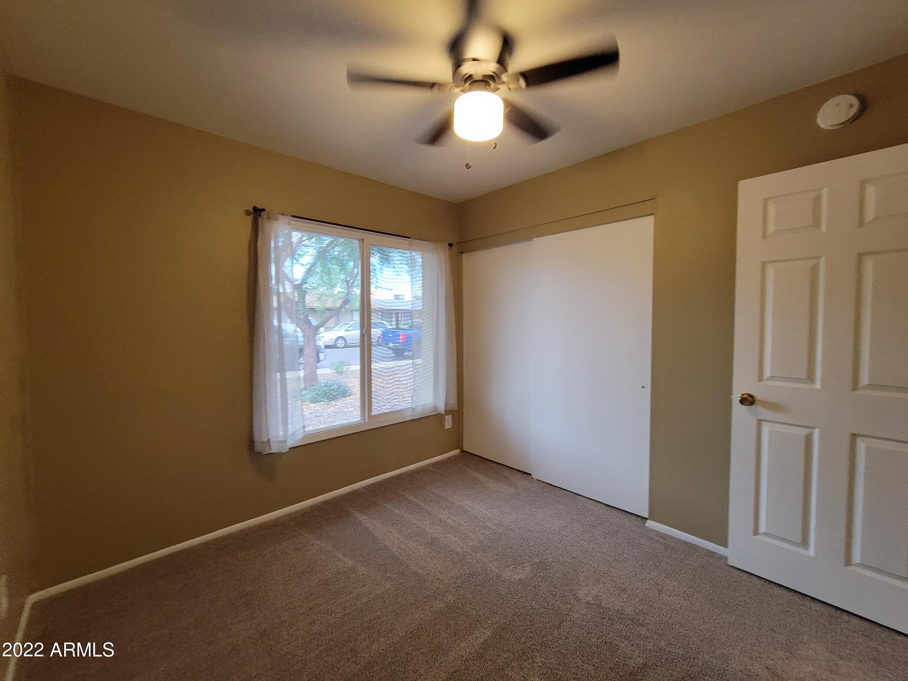 2042 West Decatur Street Mesa, AZ 85201 - Photo 29 of 38 a view of an empty room with a window