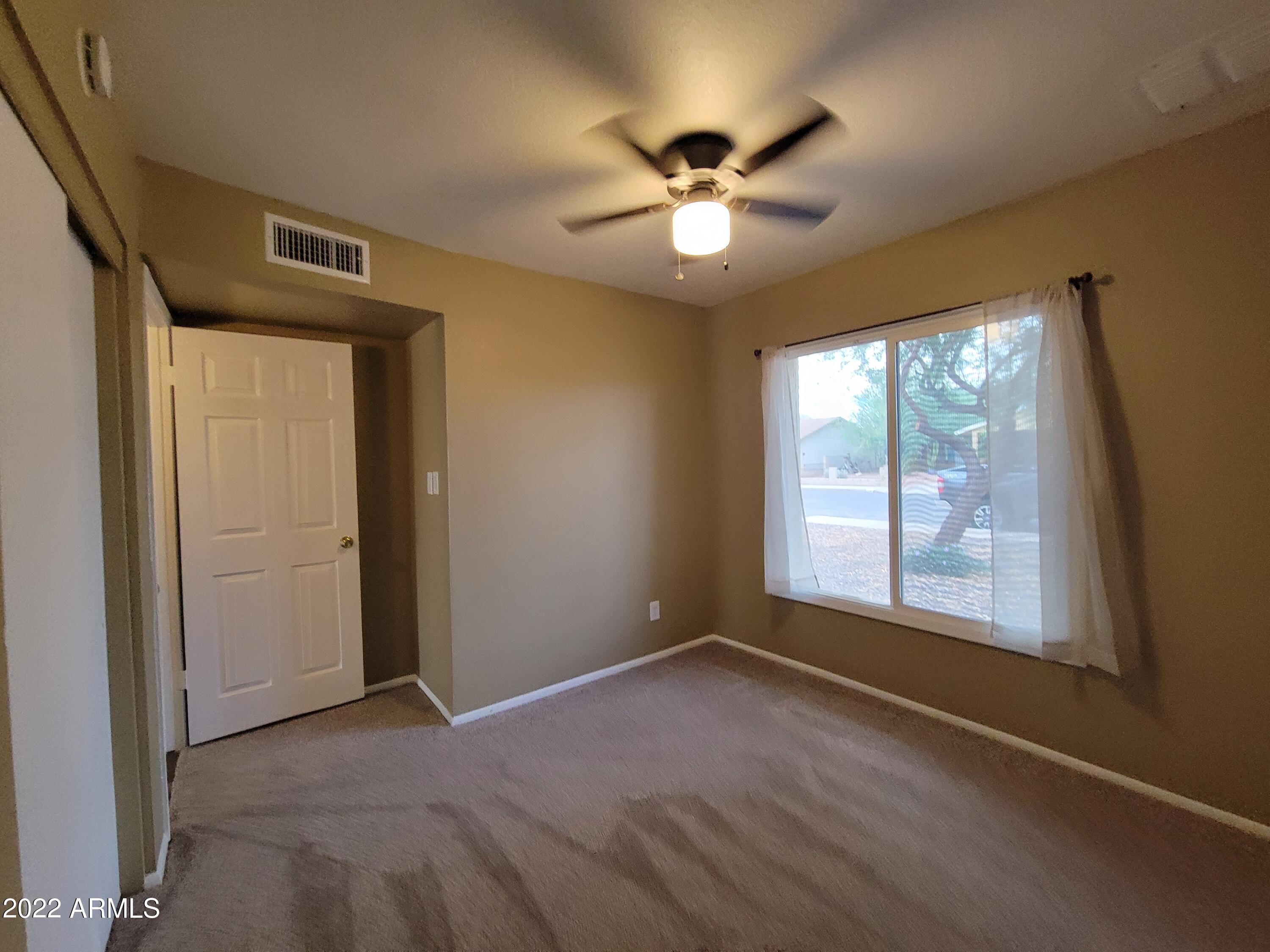 2042 West Decatur Street Mesa, AZ 85201 - Photo 30 of 38 a view of an empty room with a window