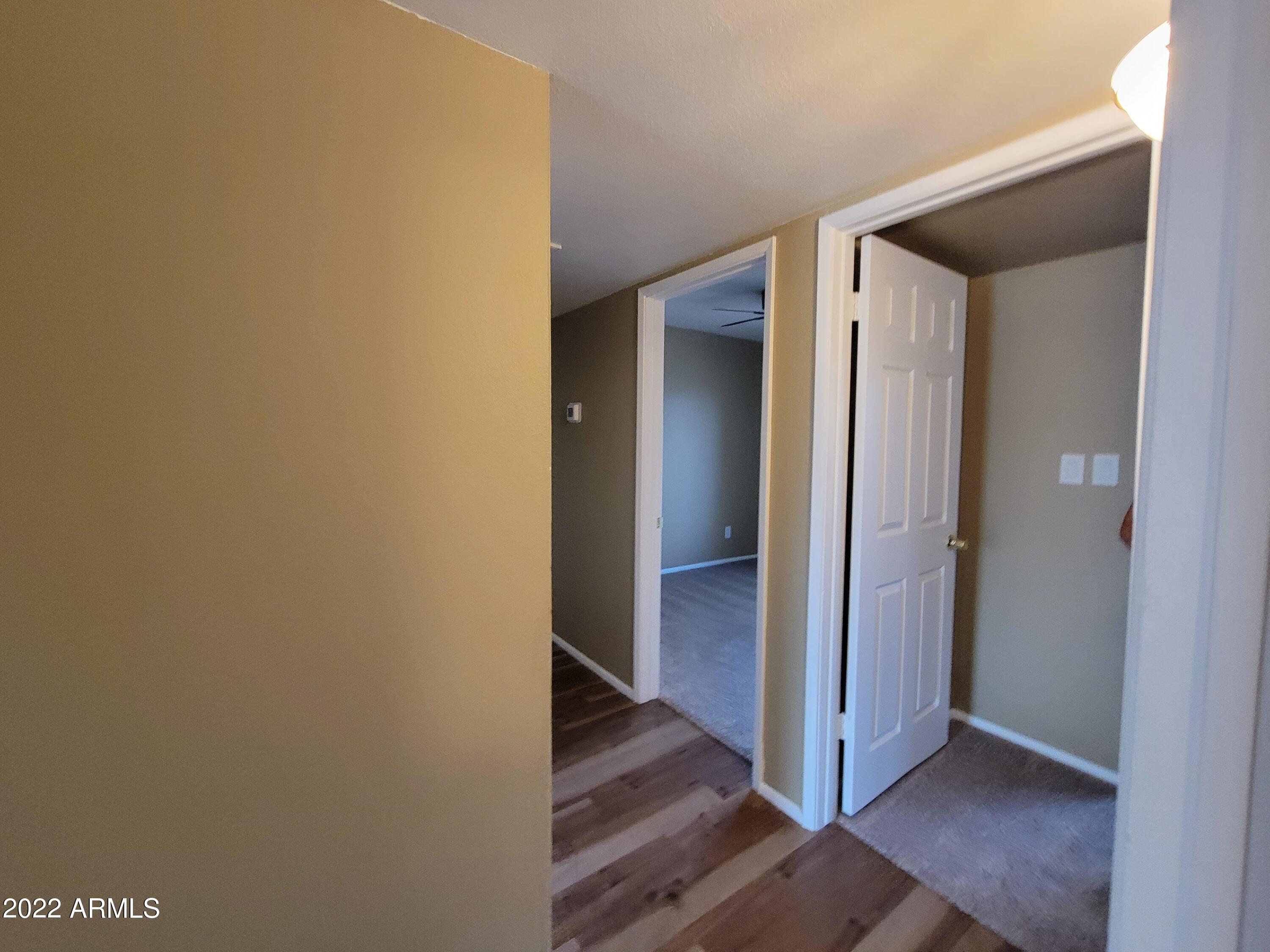 2042 West Decatur Street Mesa, AZ 85201 - Photo 35 of 38 a view of a hallway with wooden floor