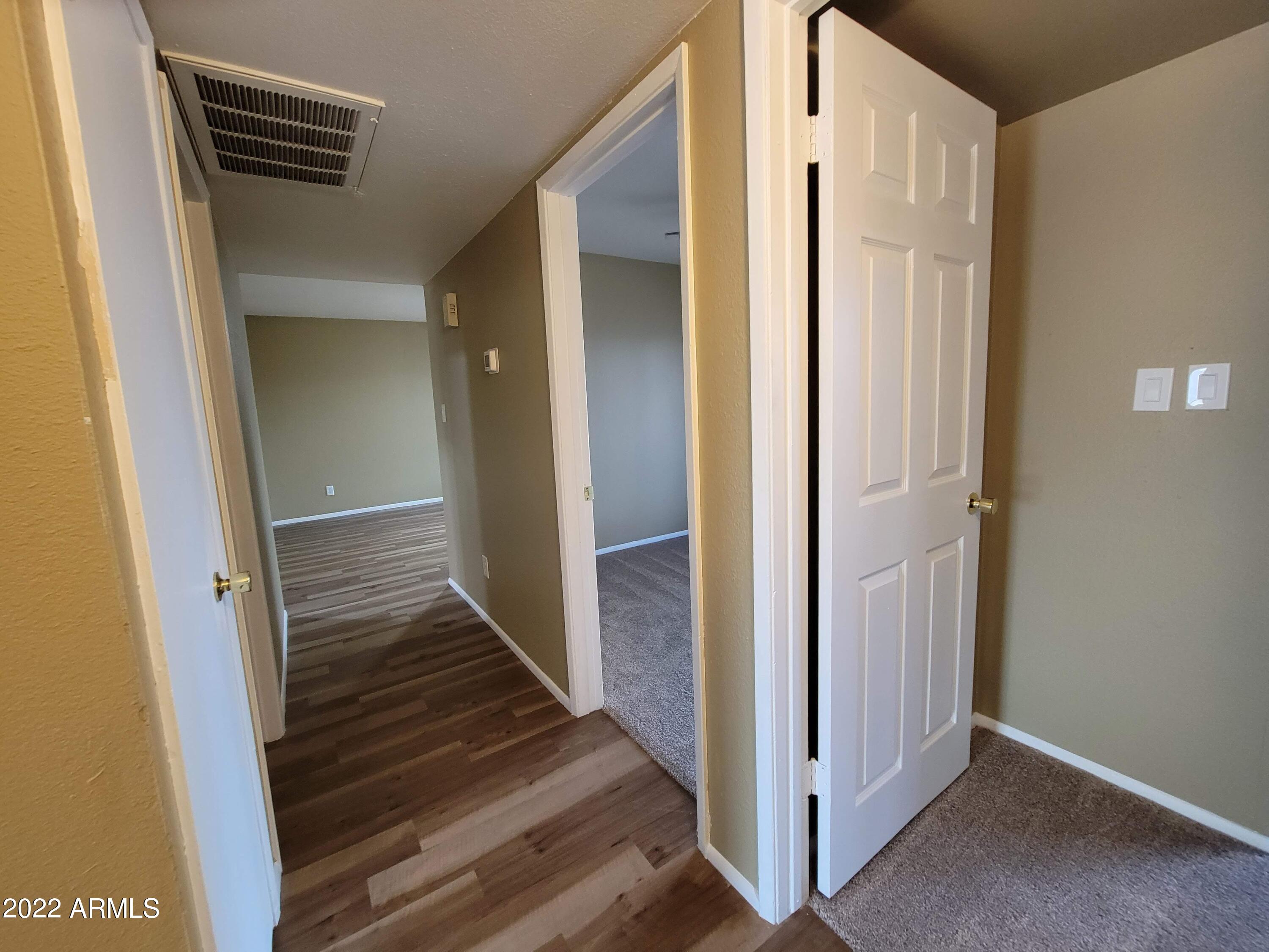 2042 West Decatur Street Mesa, AZ 85201 - Photo 36 of 38 a view of a hallway with wooden floor and entryway