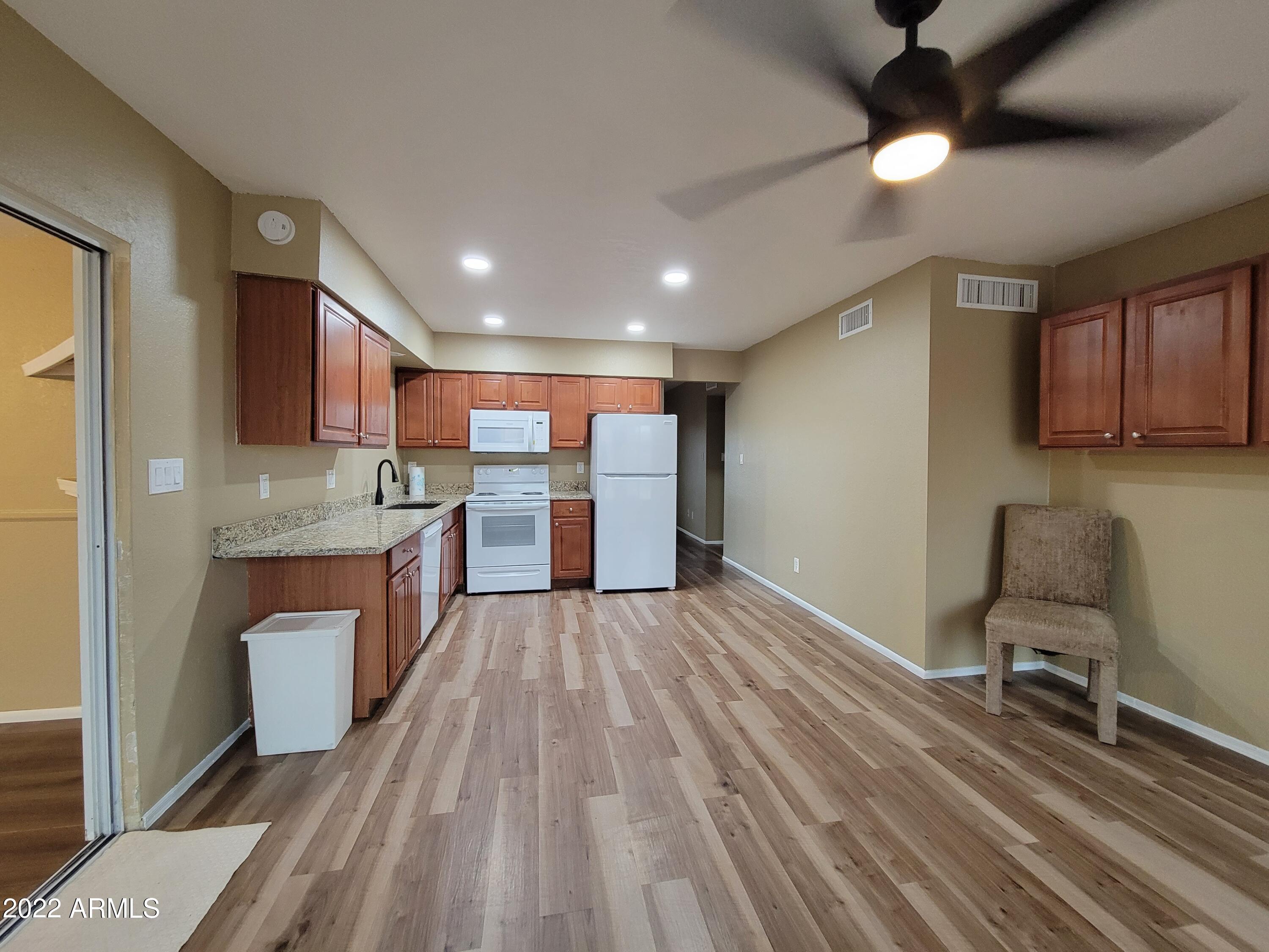 2042 West Decatur Street Mesa, AZ 85201 - Photo 5 of 38 a large kitchen with a table and chairs