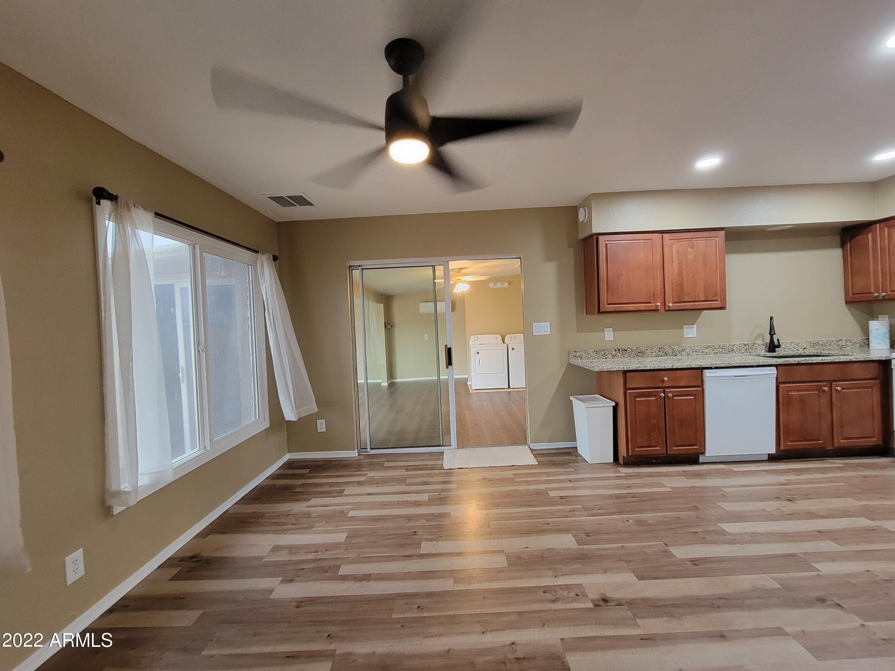 2042 West Decatur Street Mesa, AZ 85201 - Photo 6 of 38 a view of kitchen with refrigerator and window