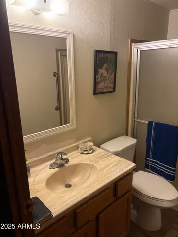 a view of a room with wooden floor and windows