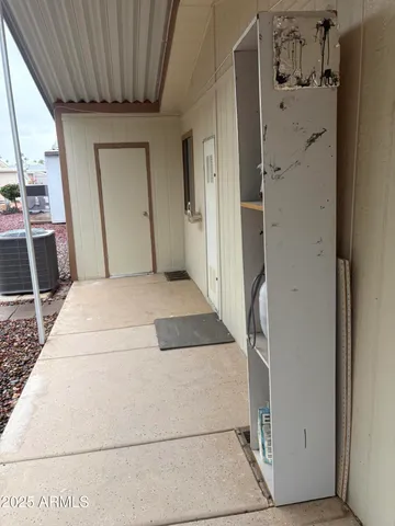 a kitchen with refrigerator and cabinets