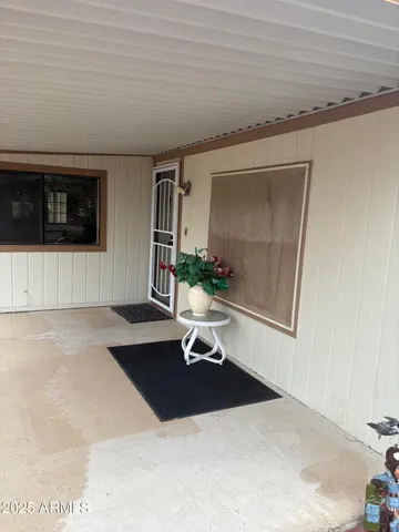 a kitchen with granite countertop a sink a stove and cabinets