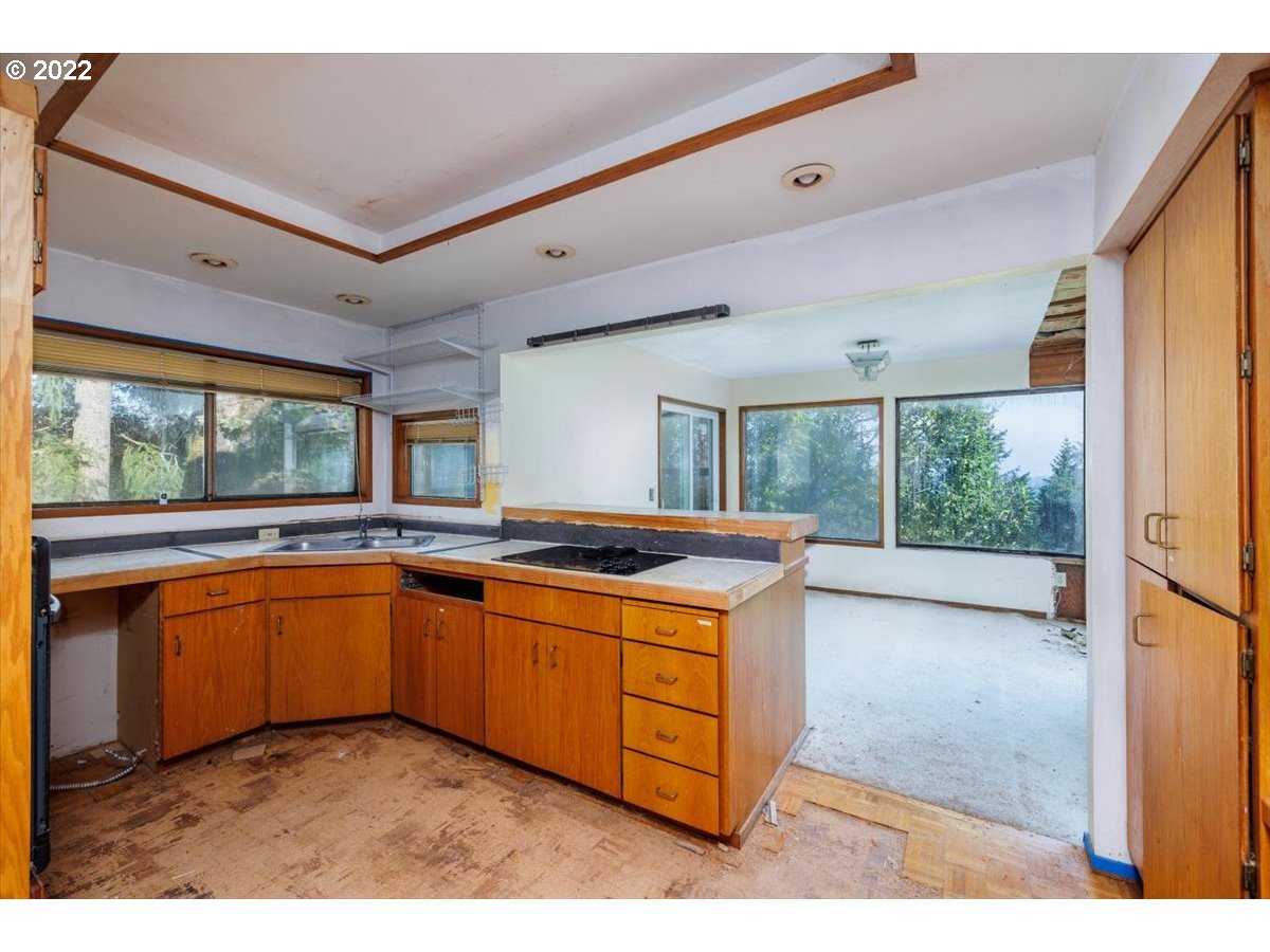 48 Eagle Crest Drive, Unit 2A Lake Oswego, OR 97035 - Photo 6 of 17 a kitchen with stainless steel appliances granite countertop a sink and a stove
