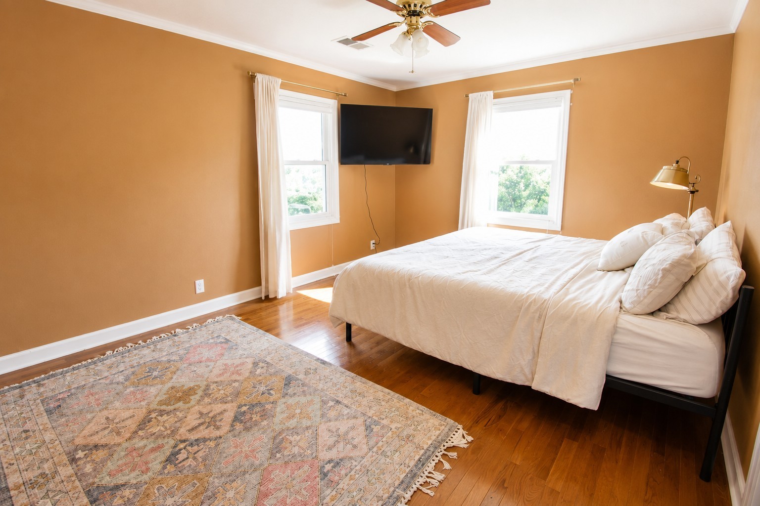 10814 Clarksville Road Olmstead, KY 42265 - Photo 27 of 55 a bedroom with a bed and a flat screen tv