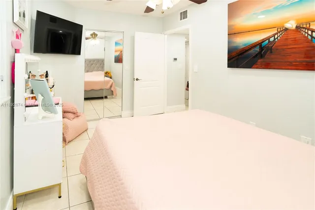 a bed room with a bed and a white wall