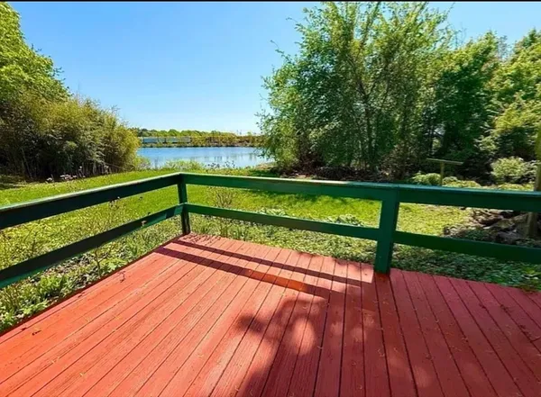 a view of small yard with wooden floor
