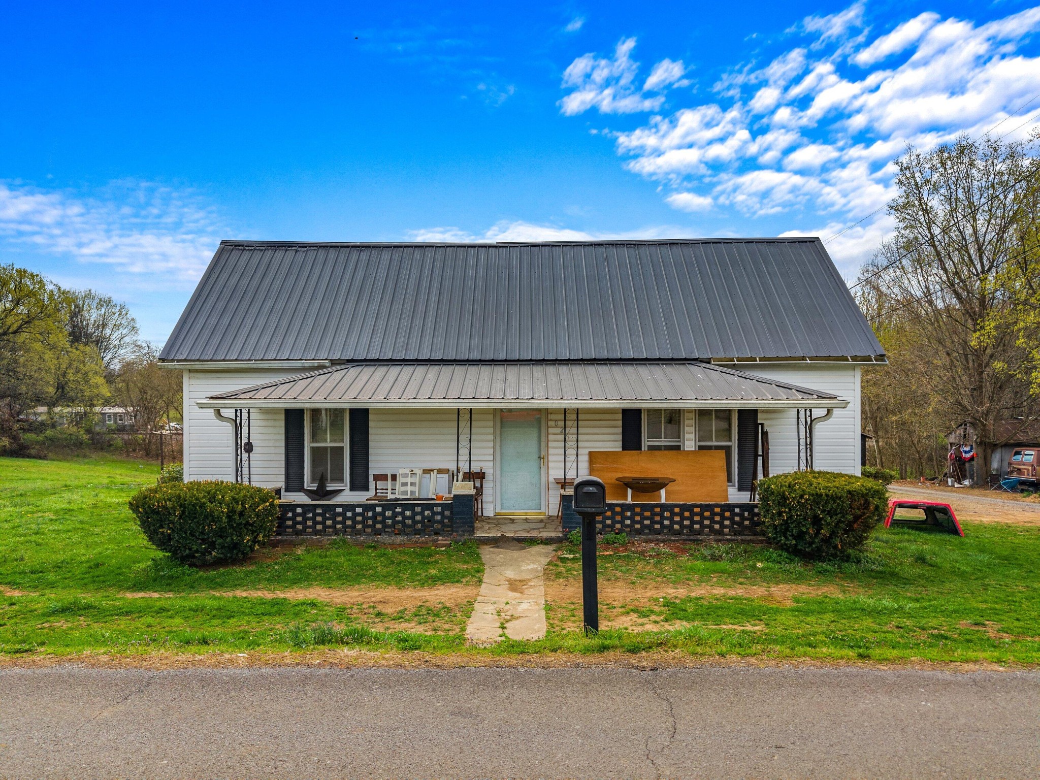 1023 Hunter Road Talbott, TN 37877 - Photo 1 of 17 a front view of house with yard and outdoor seating