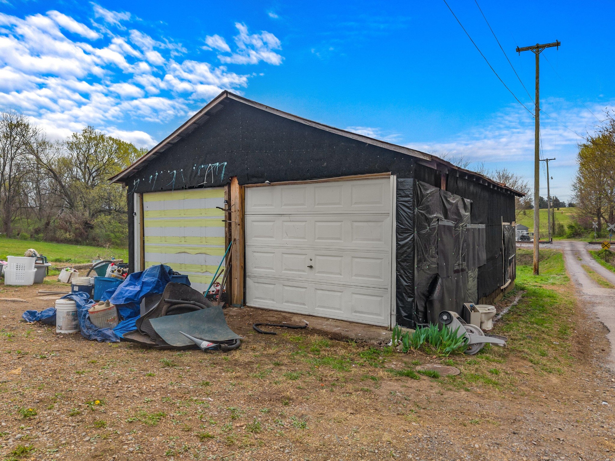 1023 Hunter Road Talbott, TN 37877 - Photo 17 of 17 a backyard of a house with barbeque oven table and chairs