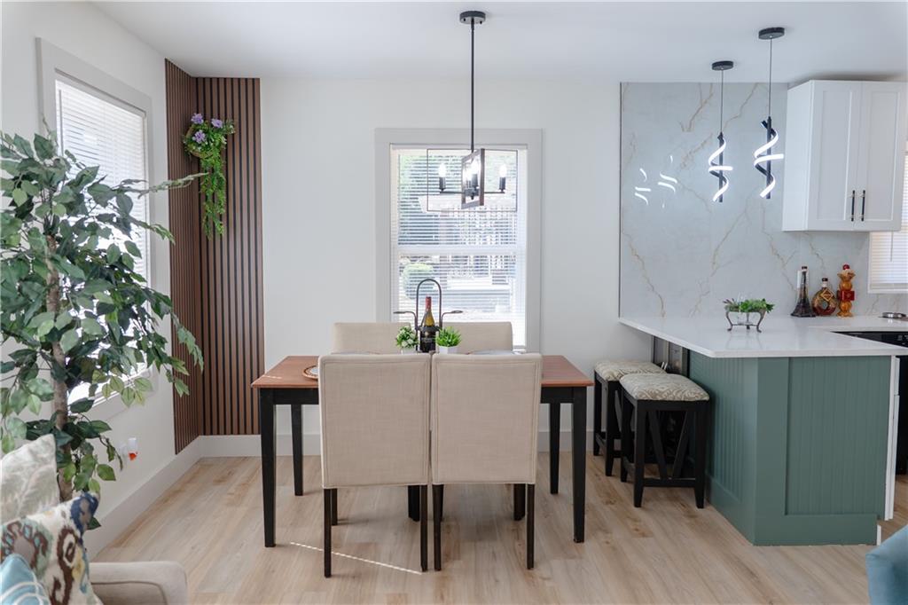 2793 Gresham Rd S East Atlanta, GA 30316 - Photo 12 of 48 a view of a dining room with furniture window and wooden floor
