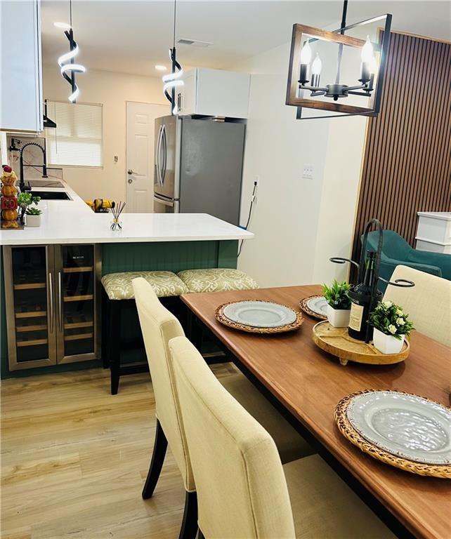 2793 Gresham Rd S East Atlanta, GA 30316 - Photo 16 of 48 a dining room with furniture and wooden floor