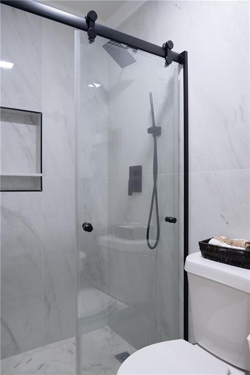 2793 Gresham Rd S East Atlanta, GA 30316 - Photo 27 of 48 a bathroom with a shower and toilet
