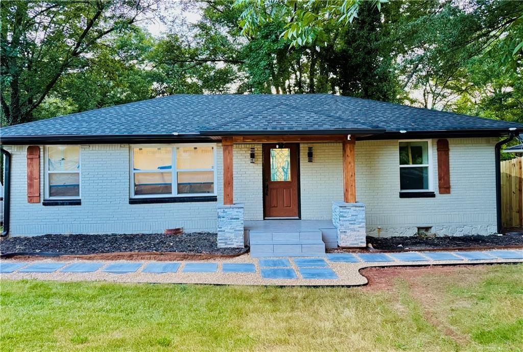2793 Gresham Rd S East Atlanta, GA 30316 - Photo 3 of 48 a front view of house with yard swimming pool and outdoor seating