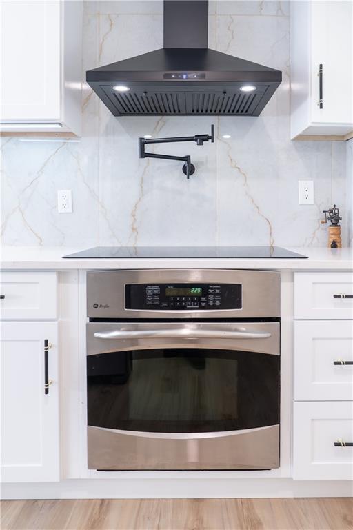 2793 Gresham Rd S East Atlanta, GA 30316 - Photo 40 of 48 a stove top oven sitting inside of a kitchen