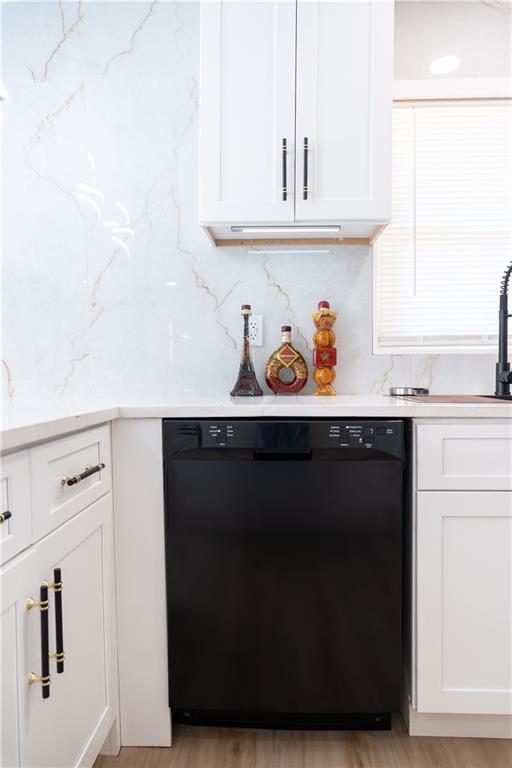 2793 Gresham Rd S East Atlanta, GA 30316 - Photo 42 of 48 a kitchen with white cabinets and a wooden floor
