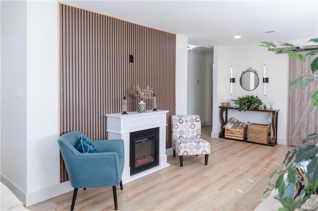 2793 Gresham Rd S East Atlanta, GA 30316 - Photo 10 of 48 a living room with furniture and a fireplace