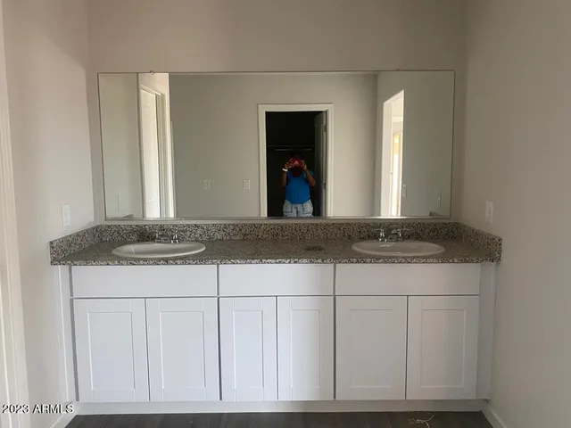 a kitchen with sink stove and microwave