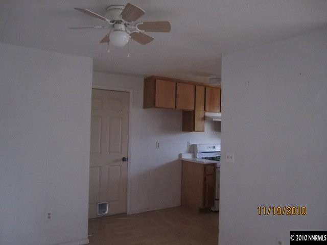 111 Empire Road Dayton, NV 89403 - Photo 4 of 13 a kitchen with a sink and cabinets