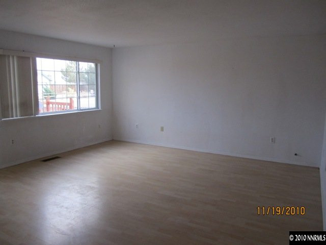 111 Empire Road Dayton, NV 89403 - Photo 5 of 13 an empty room with a window
