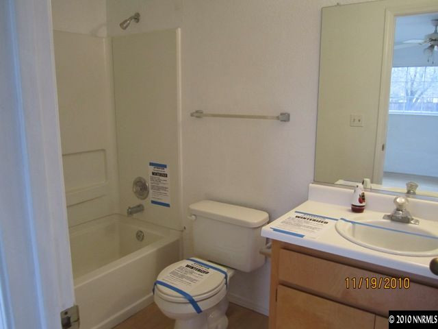 111 Empire Road Dayton, NV 89403 - Photo 8 of 13 a bathroom with a sink a toilet and shower
