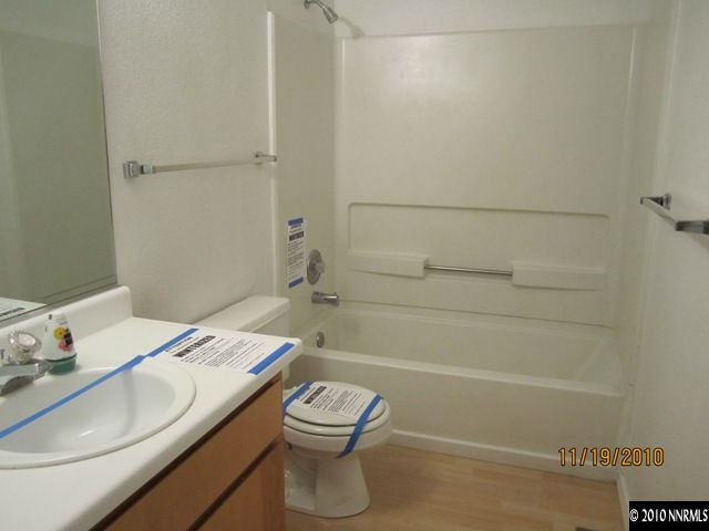 111 Empire Road Dayton, NV 89403 - Photo 9 of 13 a bathroom with a sink a toilet and shower